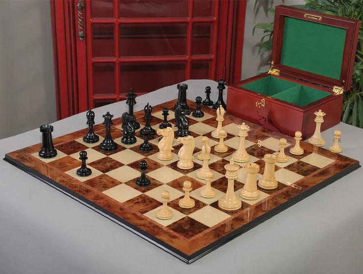 Wooden Staunton chess set on a burl board with its storage box