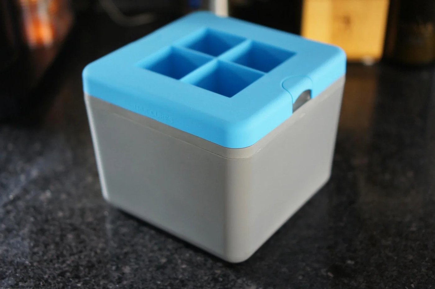 True Cubes clear ice tray with its blue lid
